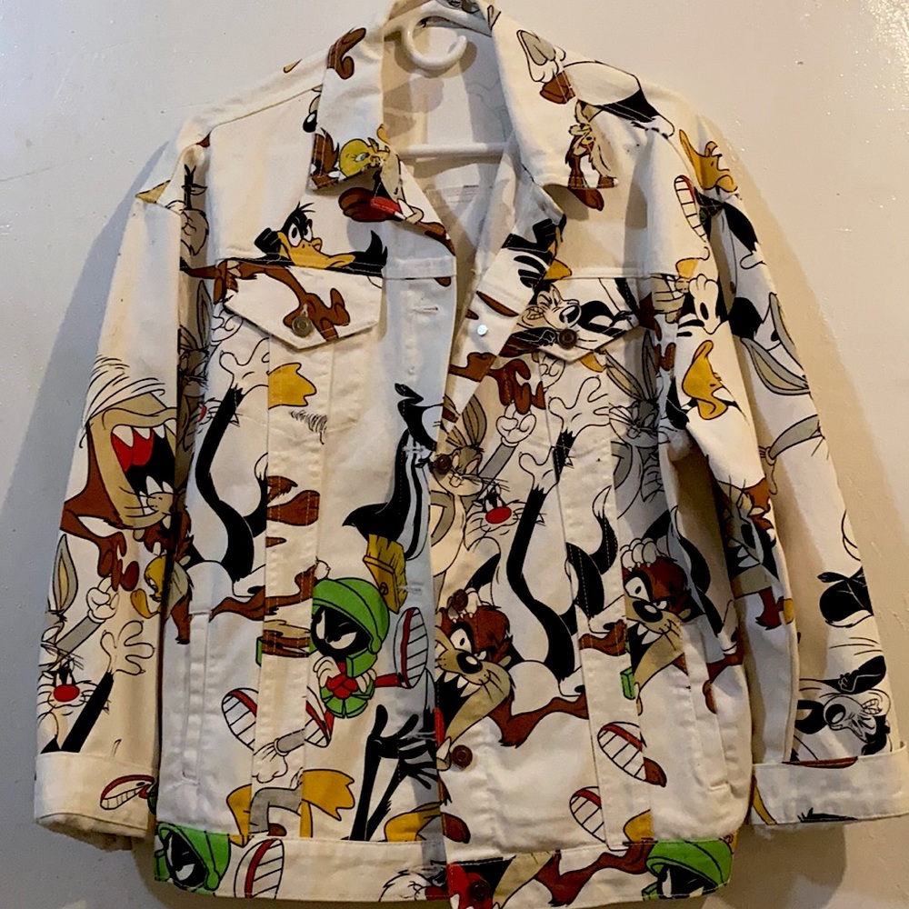 This is a graphic white denim Jean jacket